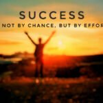 "Success is not by chance, but by effort" quote with black text and bright sunlight